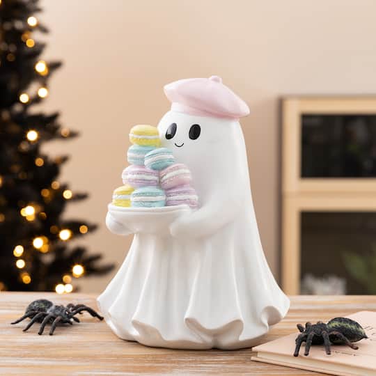 Glitzhome® 9.75" Halloween Polyresin Ghost with Macarons Table Decor